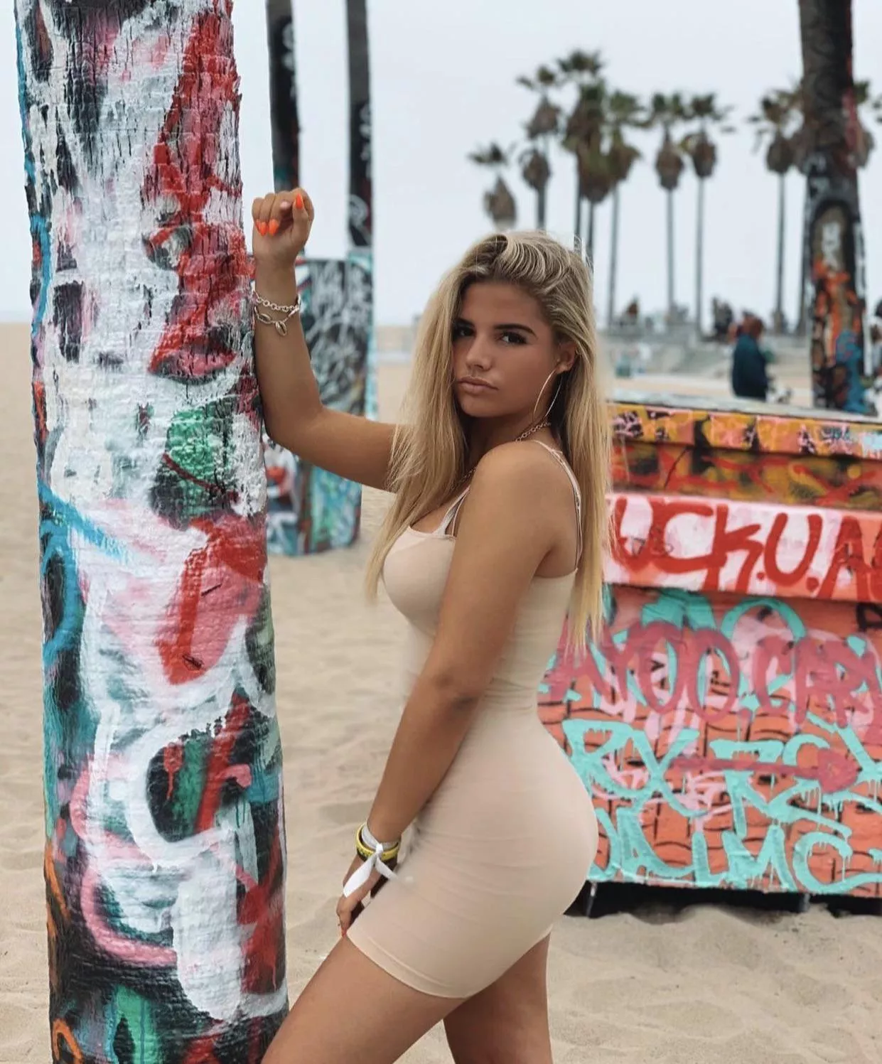 Beautiful women posing in front of graffiti posted by ResponsiveCock