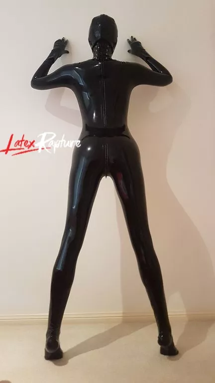 Completely covered in latex with added neck corset. Against the wall the way I like it 💋 posted by LatexRapture