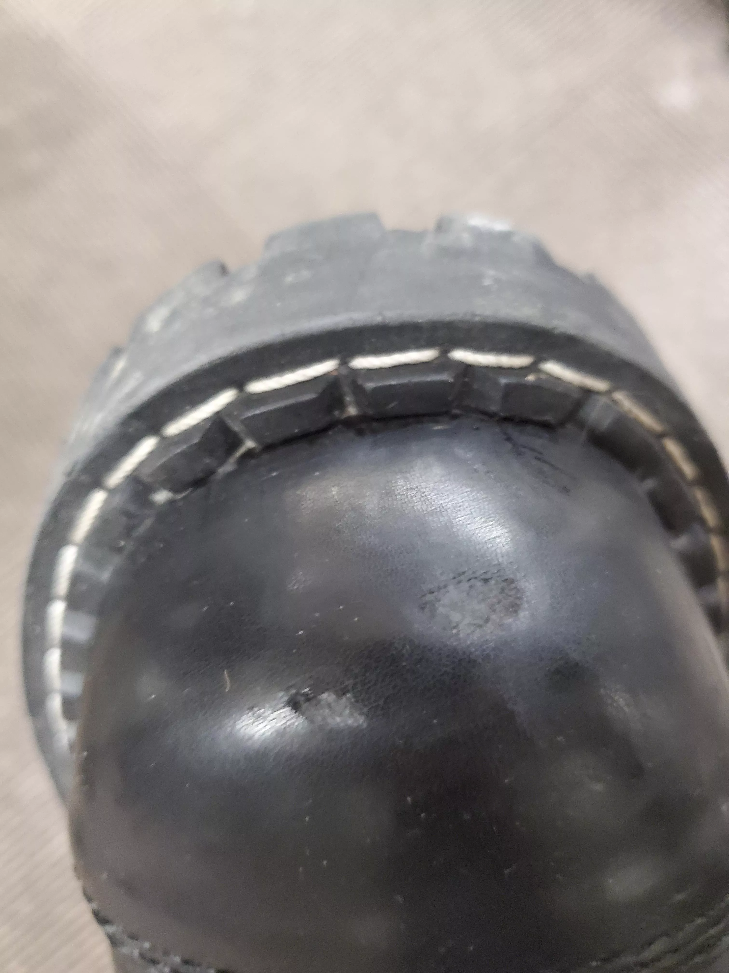 how do I care for a small hole in my boots? posted by Mister_Mail_man