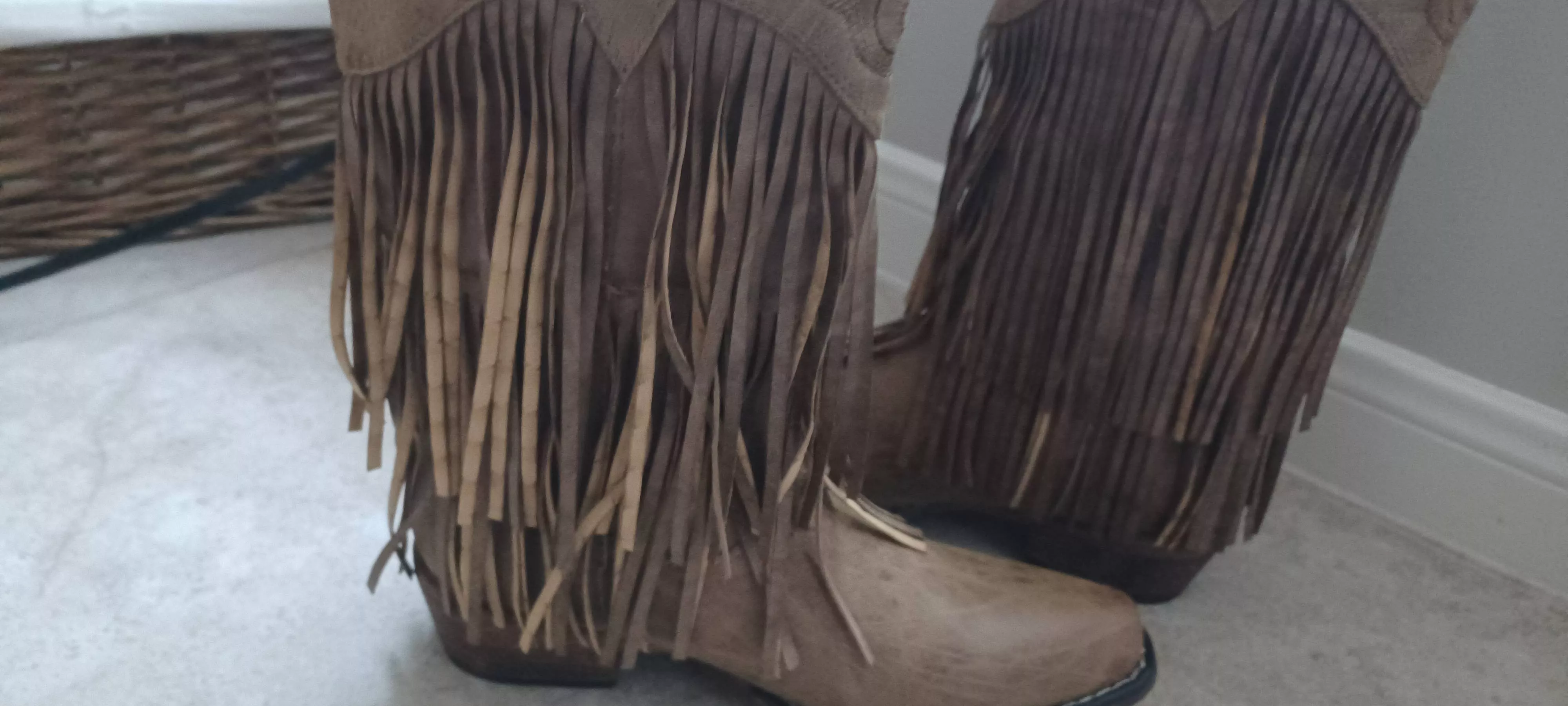 How do I straighten the fringe (left) so it looks like the right boot? Or should I return them and get my money back? posted by Desertedfoxx