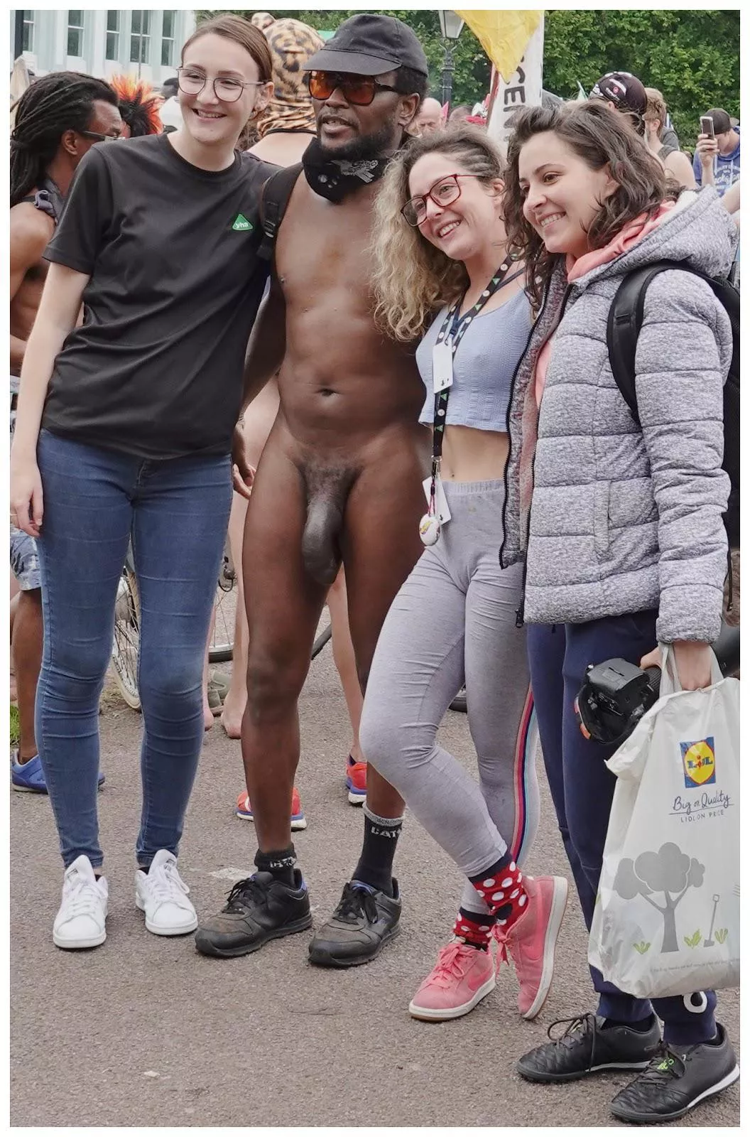 3 girls enjoy posing with a huge dick at WNBR cfnm posted by cfnmfangirl