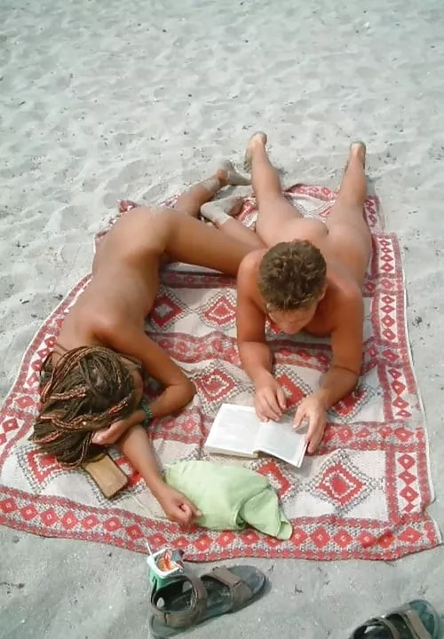 A book and a tan posted by NaturistPictures