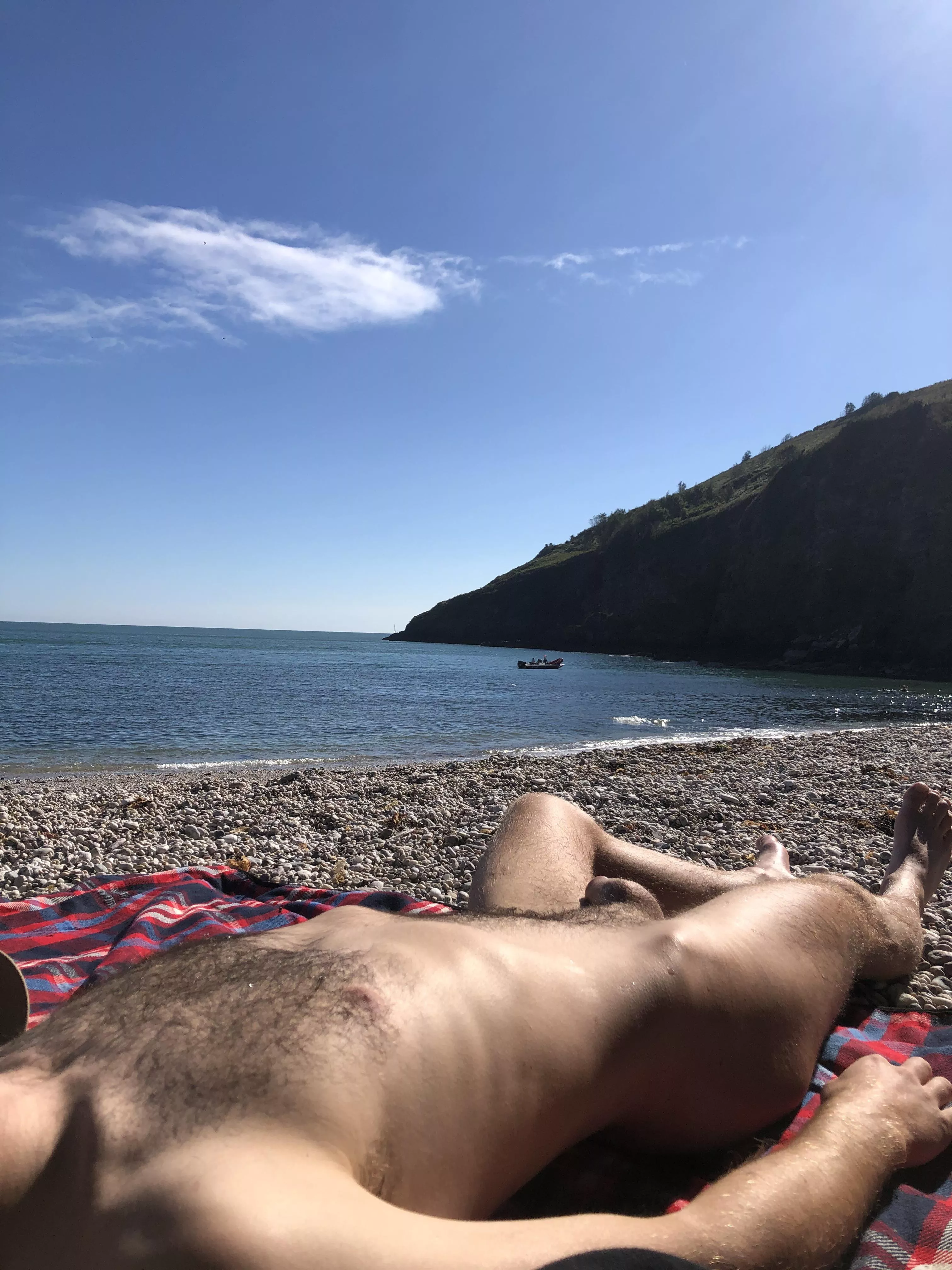 a photo i took of my bf relaxing nude on the beach posted by devoneater1