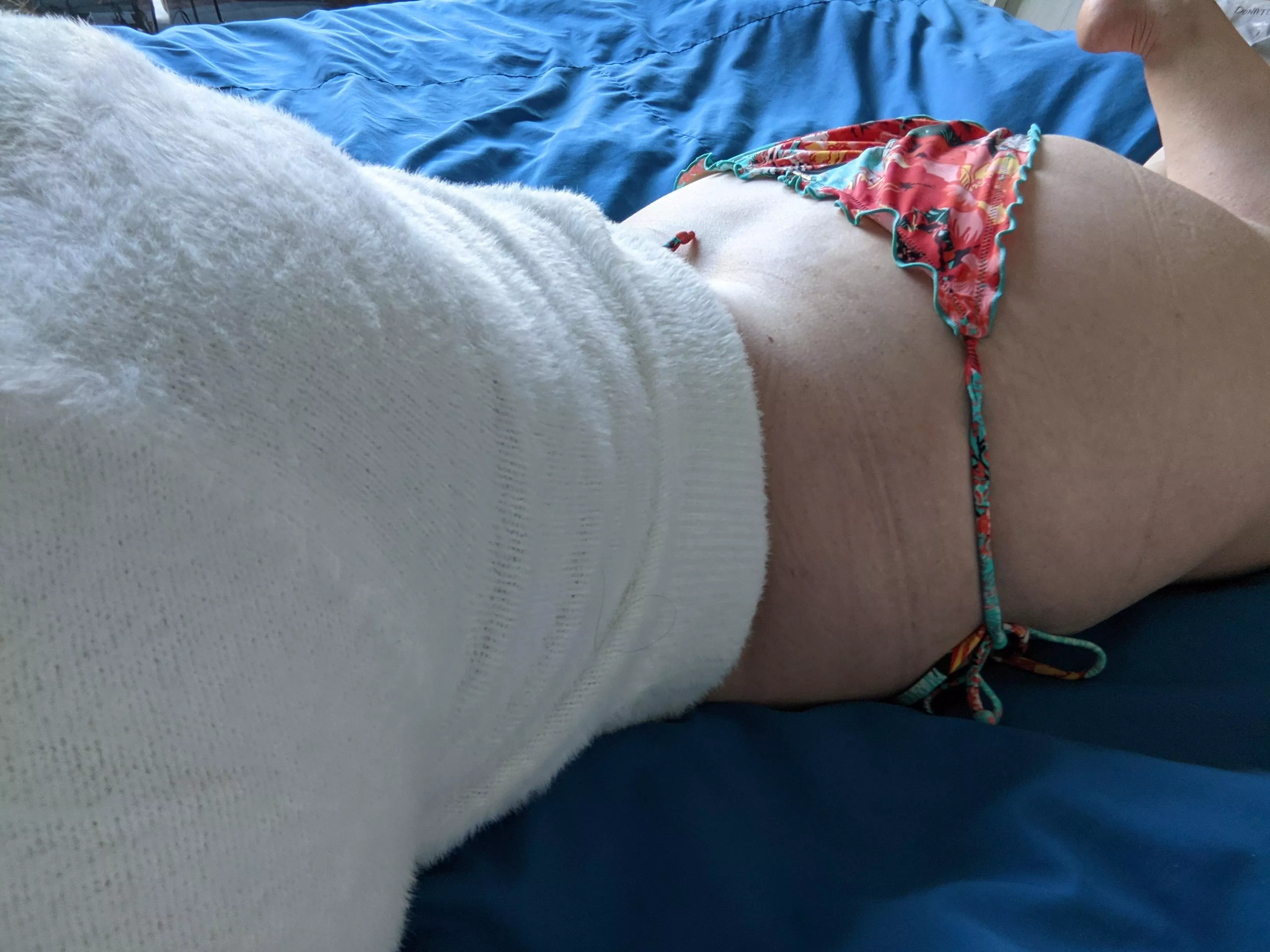 A tale of contradiction: a soft, fuzzy, white midriff sweater and colourful bikini bottoms! [F] posted by make_me_a_good_girl