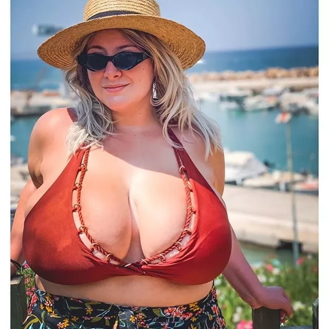 Big blonde stuffed into a bikini top posted by Udderluvr2020