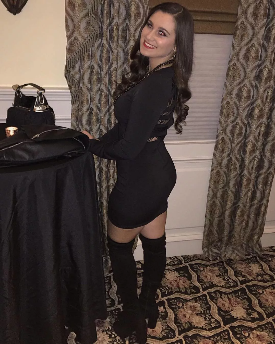 Black dress babe posted by Confident-Bell2560