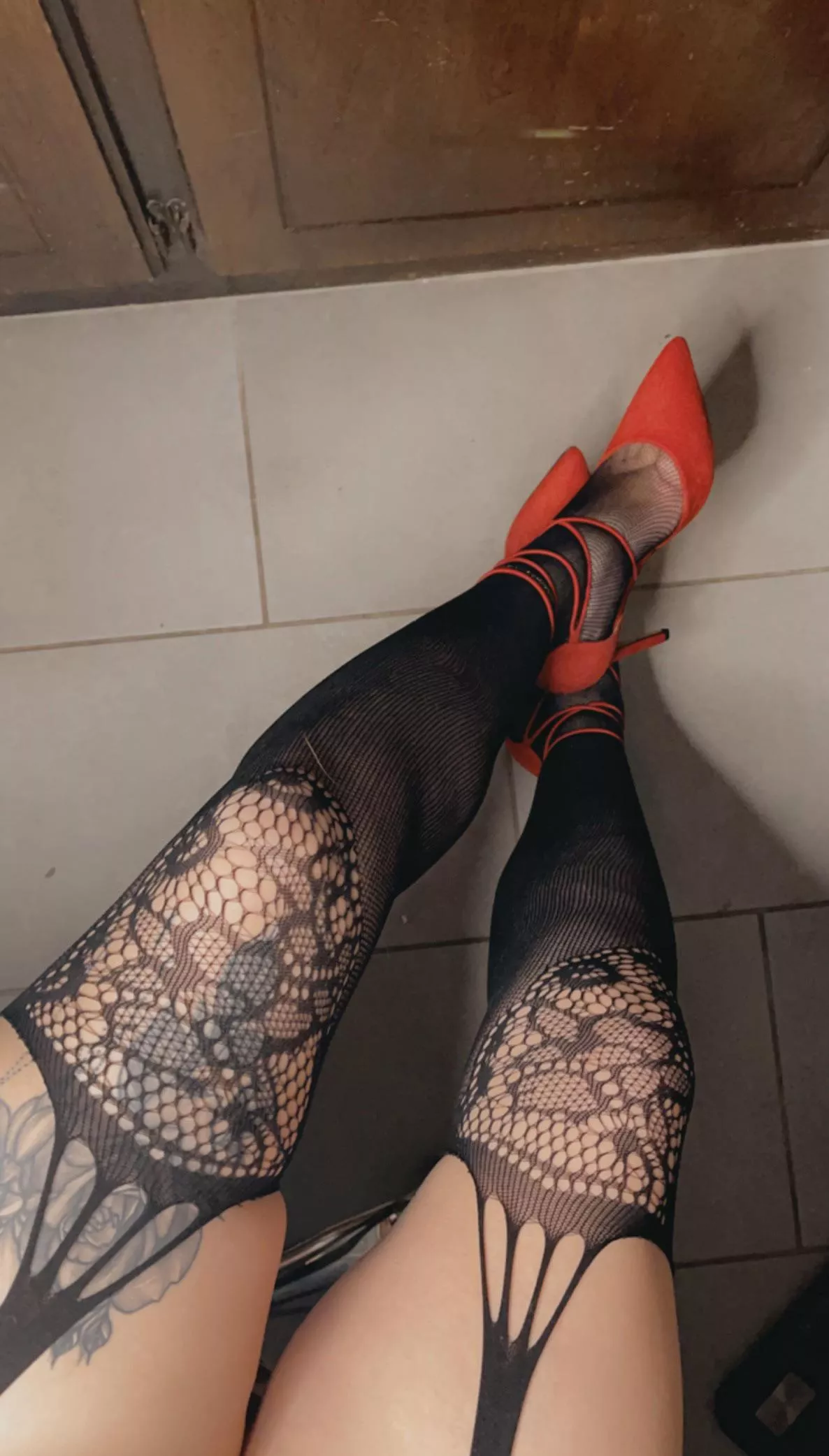 Can’t go wrong with fishnets and red heels posted by Sugabby_b