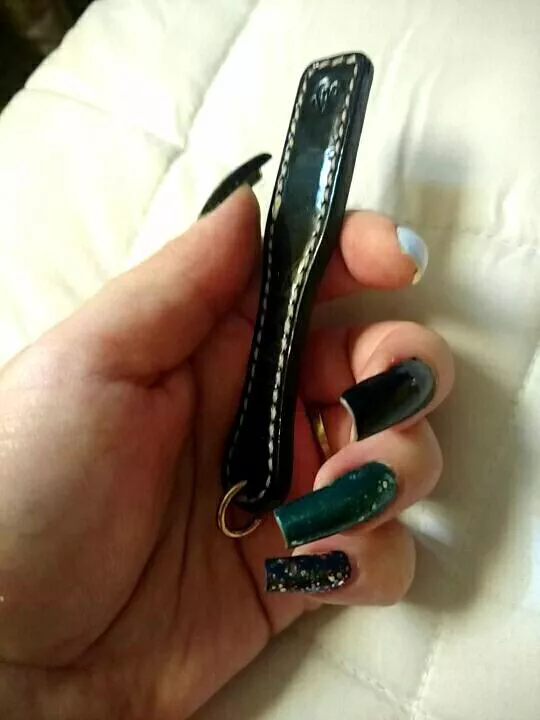 [closeup] do u like my FEARSOME leather paddle? Natural nails! posted by stingraystarseed