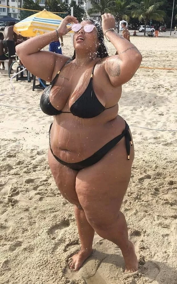 Confident bikini babe cooling down on the beach posted by Udderluvr2020