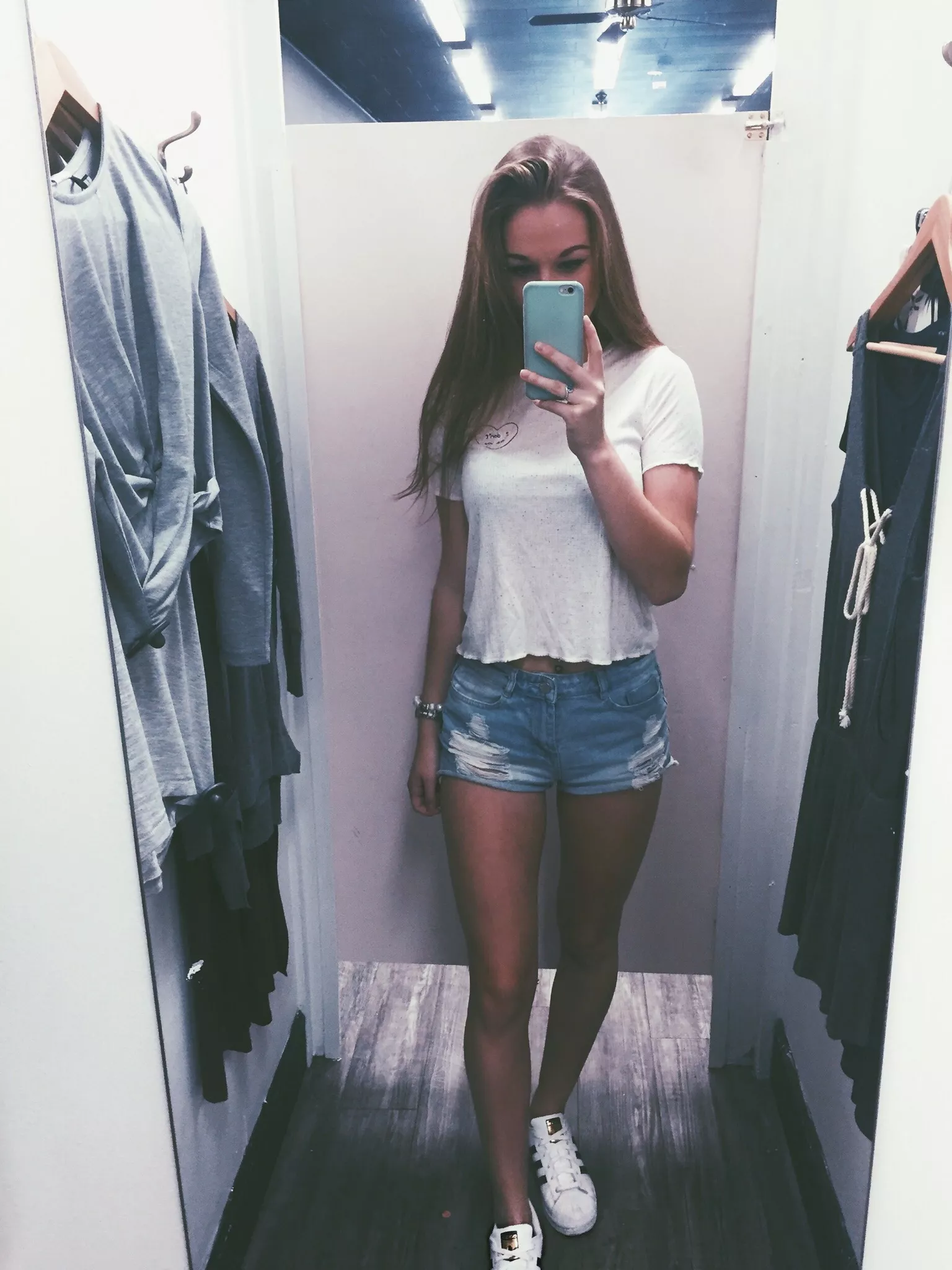 Fitting room selfie posted by LayDownYourBurdens