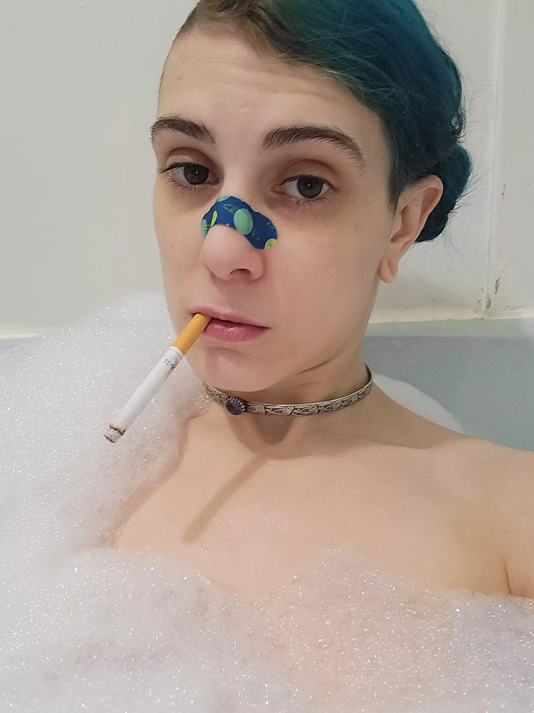 Hehe just having a smoke in the bath 🥰 pardon my bandaid, my nose is stuffy and bandaids fix boo-boos, right? 😅🤣 posted by Kinkylittlehippy