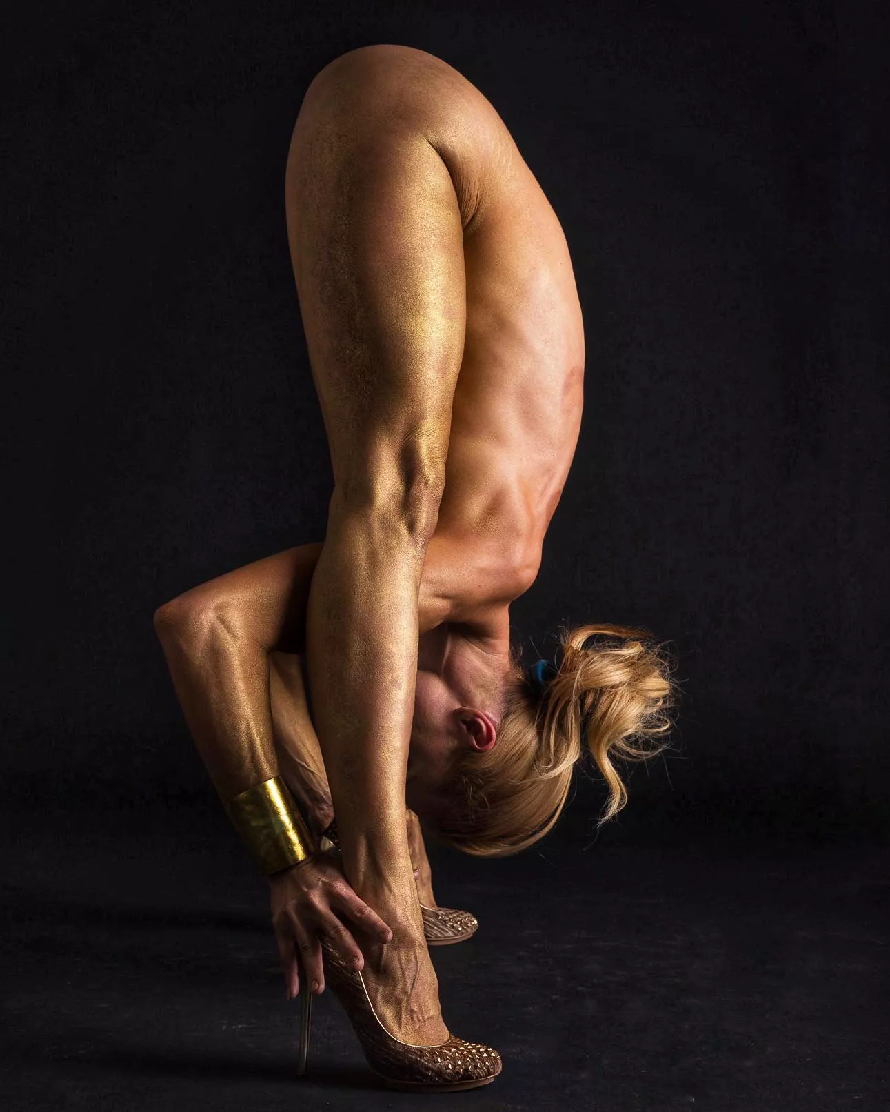 Here's a beautiful and out of the ordinary Prasarita Padottanasana pose posted by YogaPhotographer