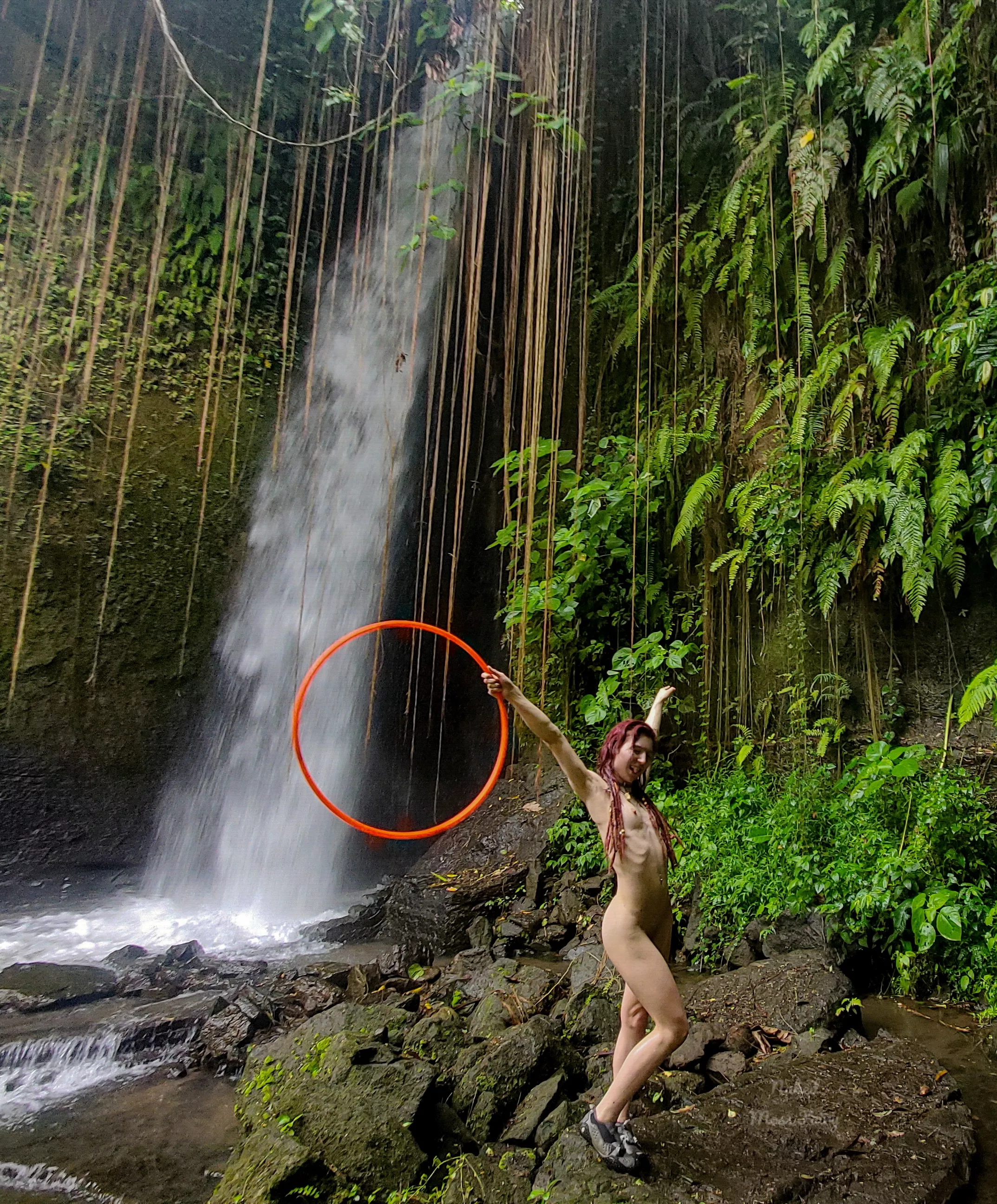 I feel euphoric anywhere next to a waterfall, especially when I get to play with my hula hoop naked!🥰💦 posted by NakedMossFairy