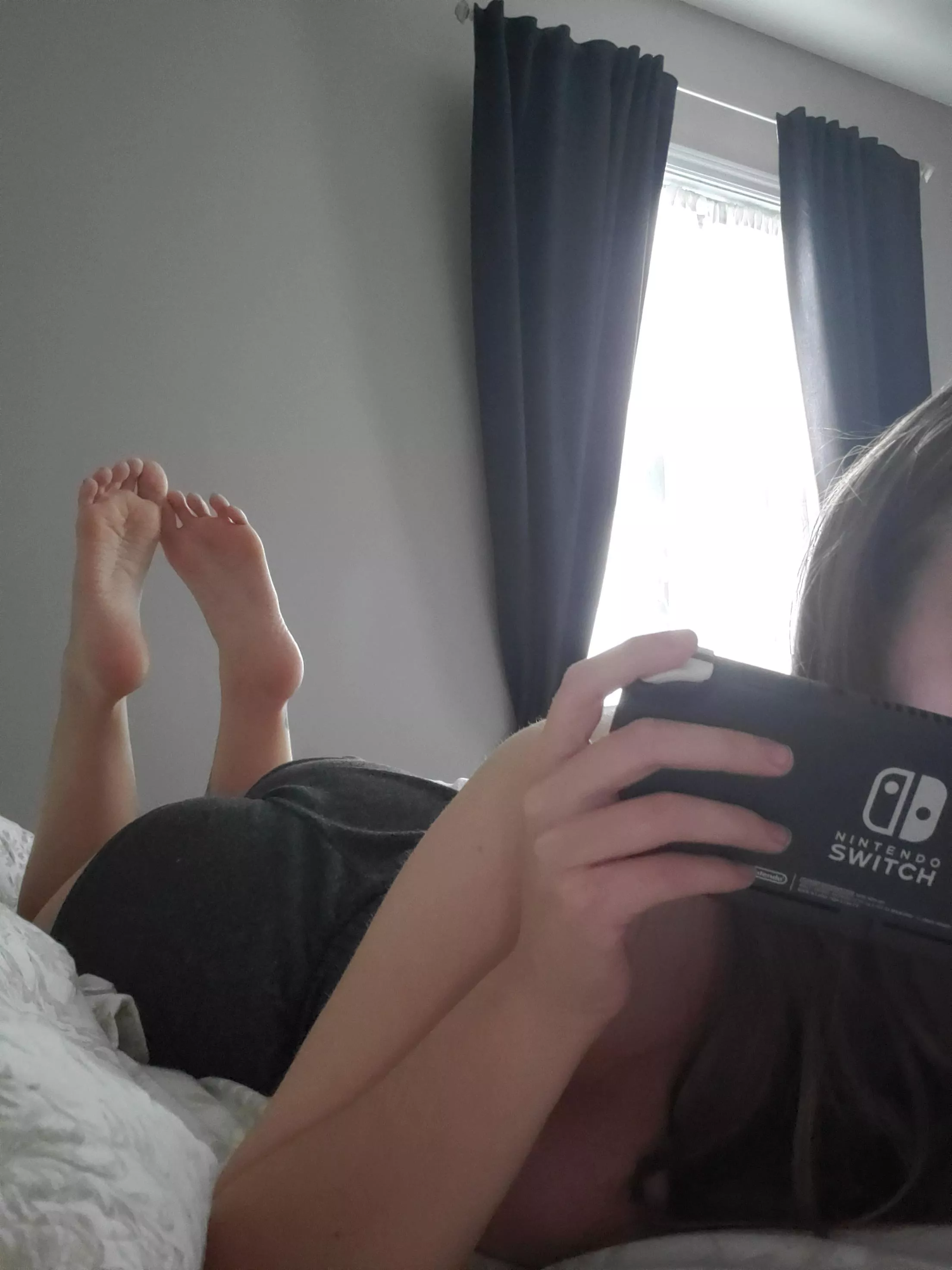 I'm feeling lazy, let me give you a footjob while I play my game posted by knottykitti