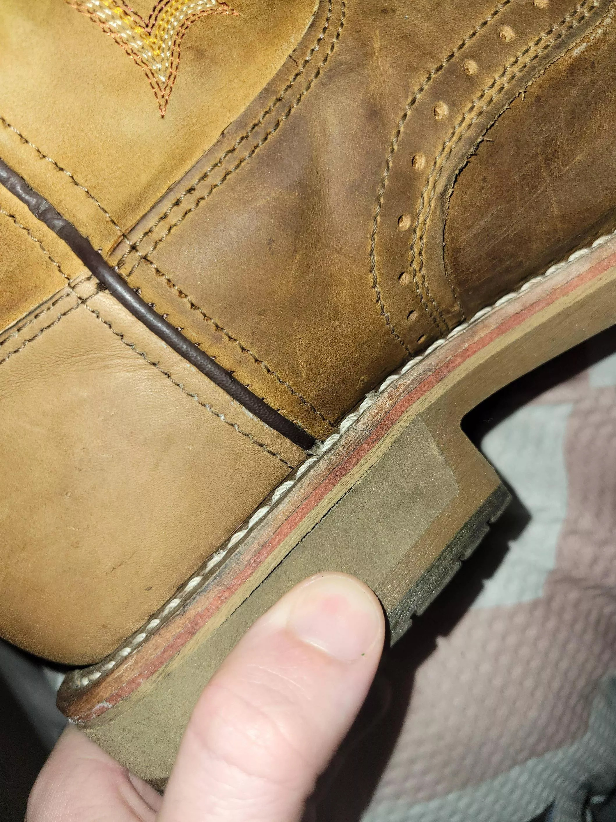 Is this little split on the heel of my fucking boots a big deal? Paid big money for these. posted by AC2BHAPPY