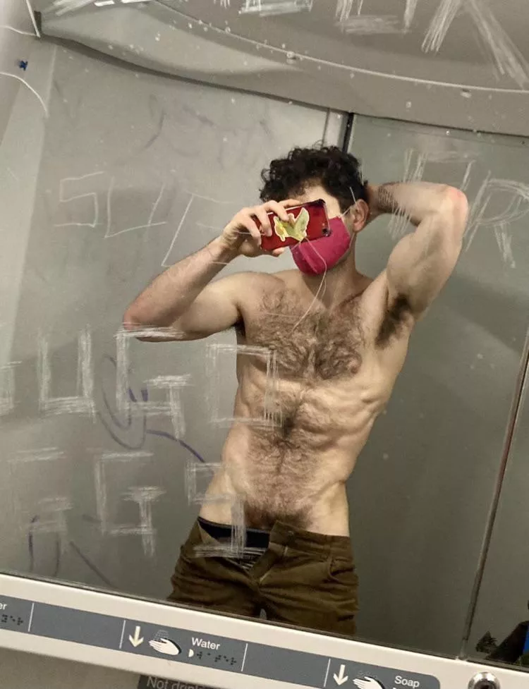 Mask on, shirt off. Public toilet, private fun posted by J-Harker