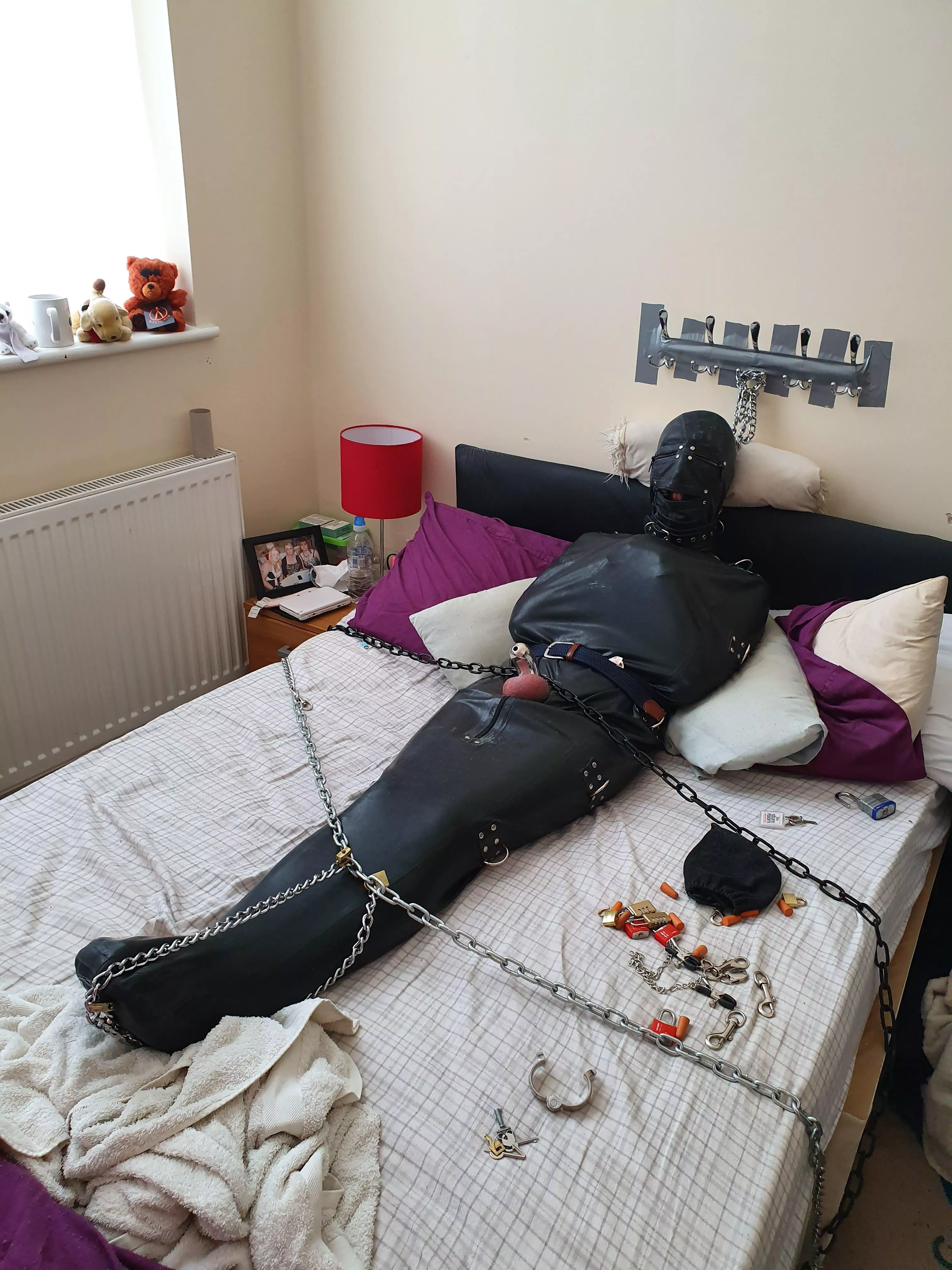 Me all sleepsacked in rubber suit, chained & padlocked & handcuffed & collared & gagged in chastity for god knows how long while my partner was at work with the keys ;) posted by jimbob0702