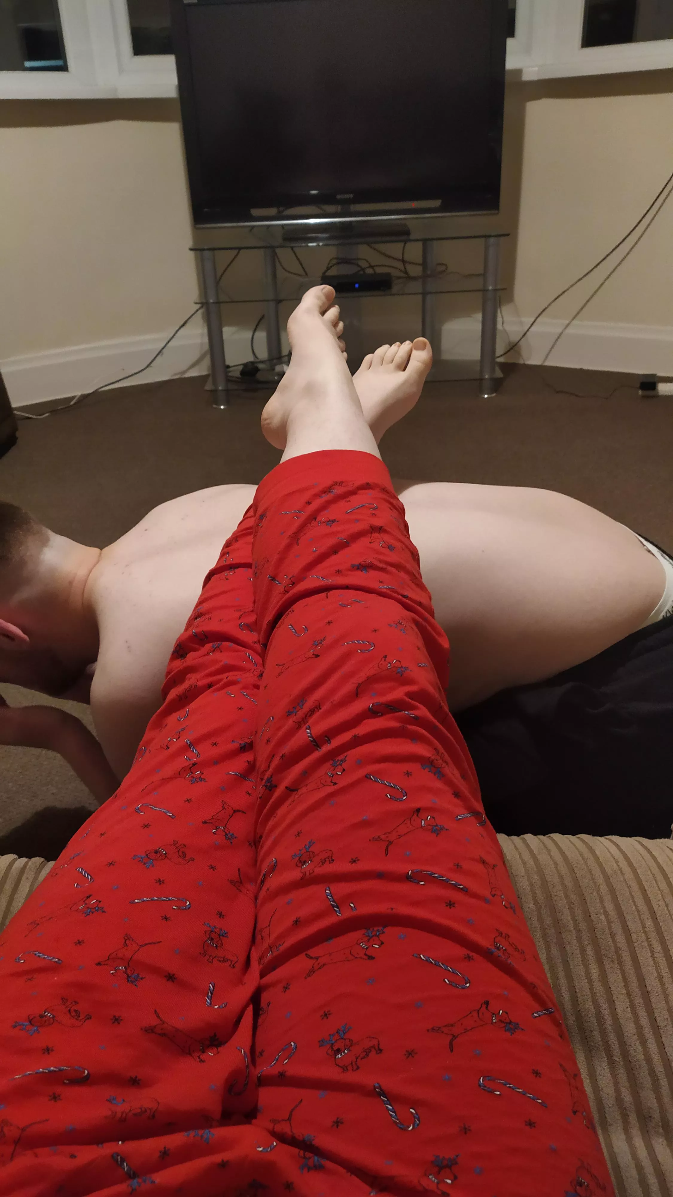 My boy being a good little foot stool 🥰 posted by dommeof2babies