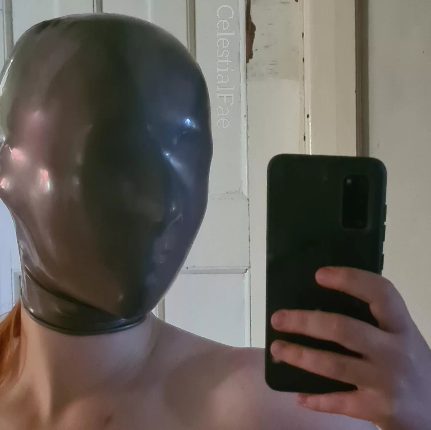 Mysterious redhead in micro-perforated latex hood 🤣 posted by double_clone