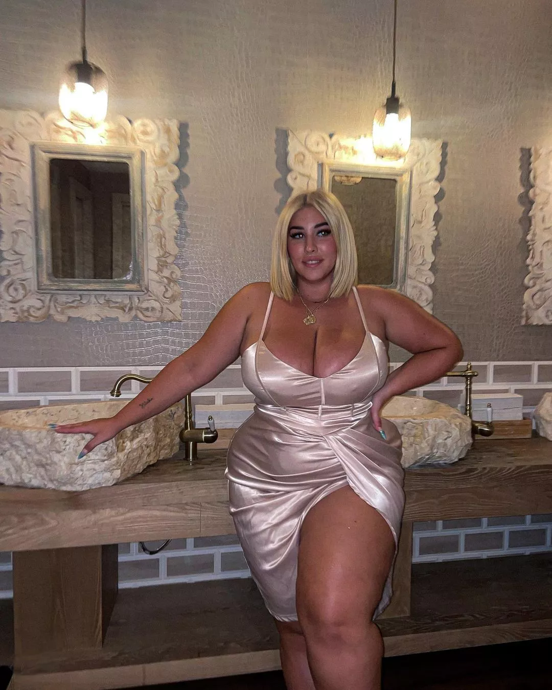 Natalia Lozano's thick thighs peeking out of her dress posted by Udderluvr2020