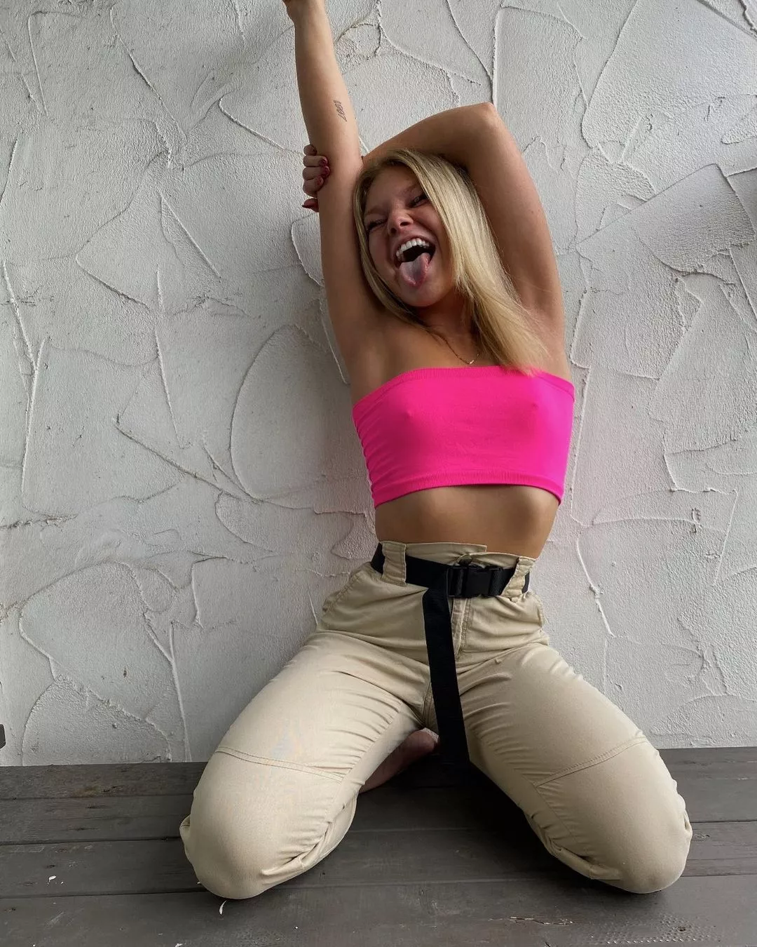 Neon pink crop top posted by LayDownYourBurdens