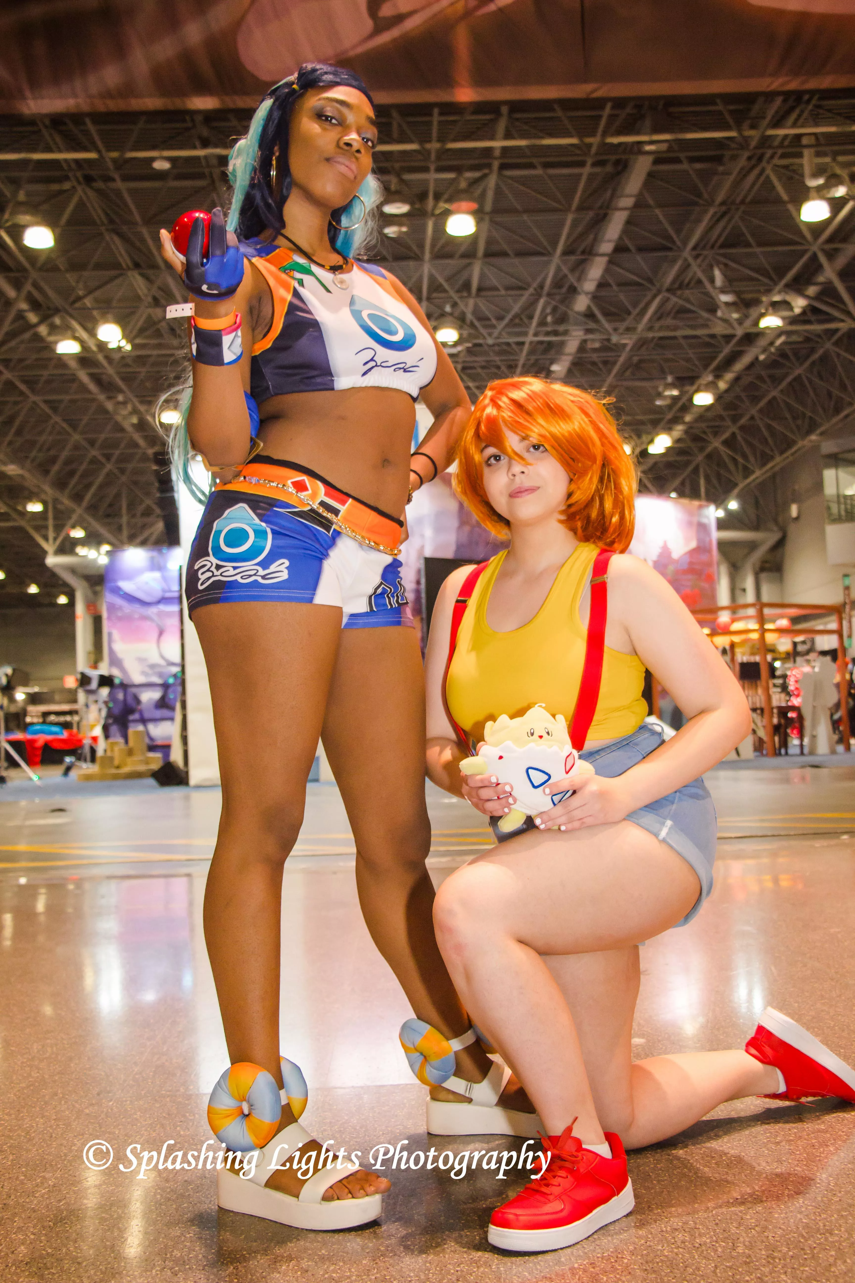 Nessa & Misty from 'Pokemon' at AnimeNYC 2021 portrayed by coserkaze & coserjuju. Photography by Splashing Lights Photography (me) posted by MD_FunkoMa