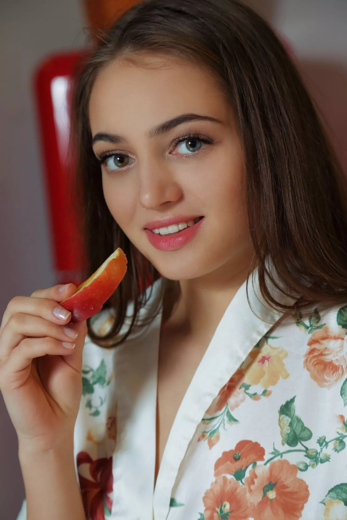 Pretty girl with slice of apple posted by poogramsupervisor