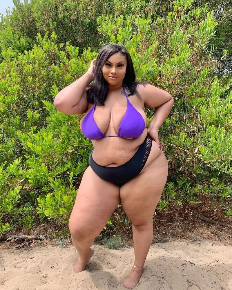 Showing off her round beach body posted by Udderluvr2020