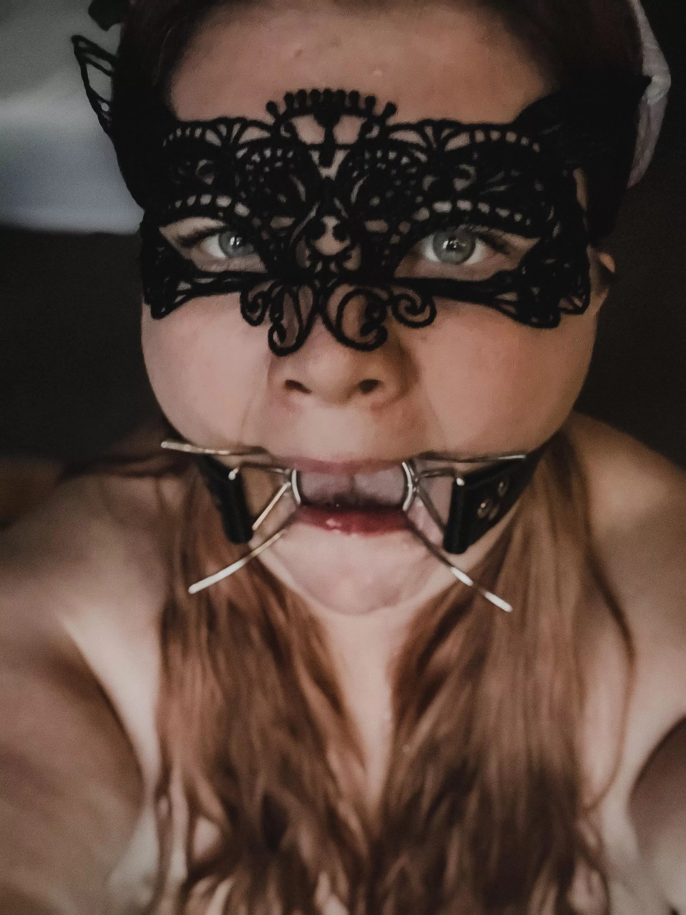 This blue eyed BBW loves her new spider gag. posted by MaskedAndUsed