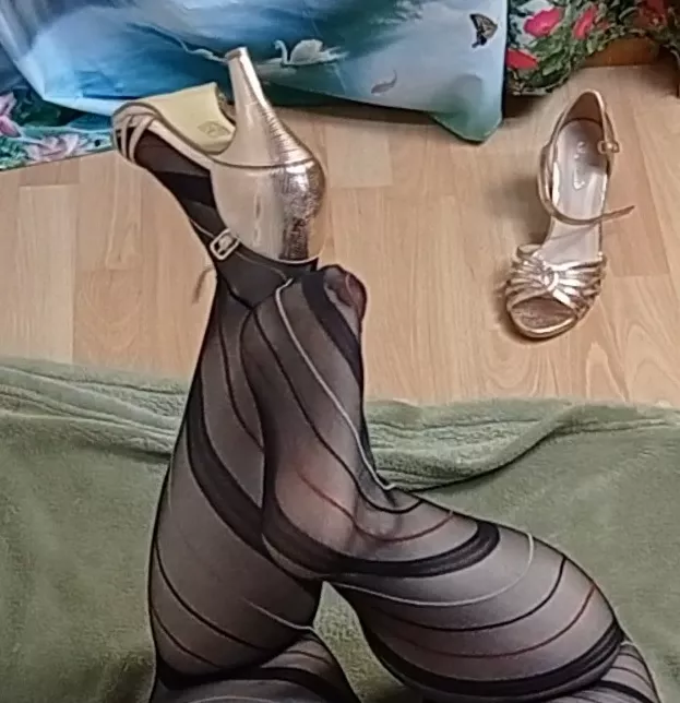 trying to take off my golden heels with my foot posted by Wriggly_Feet