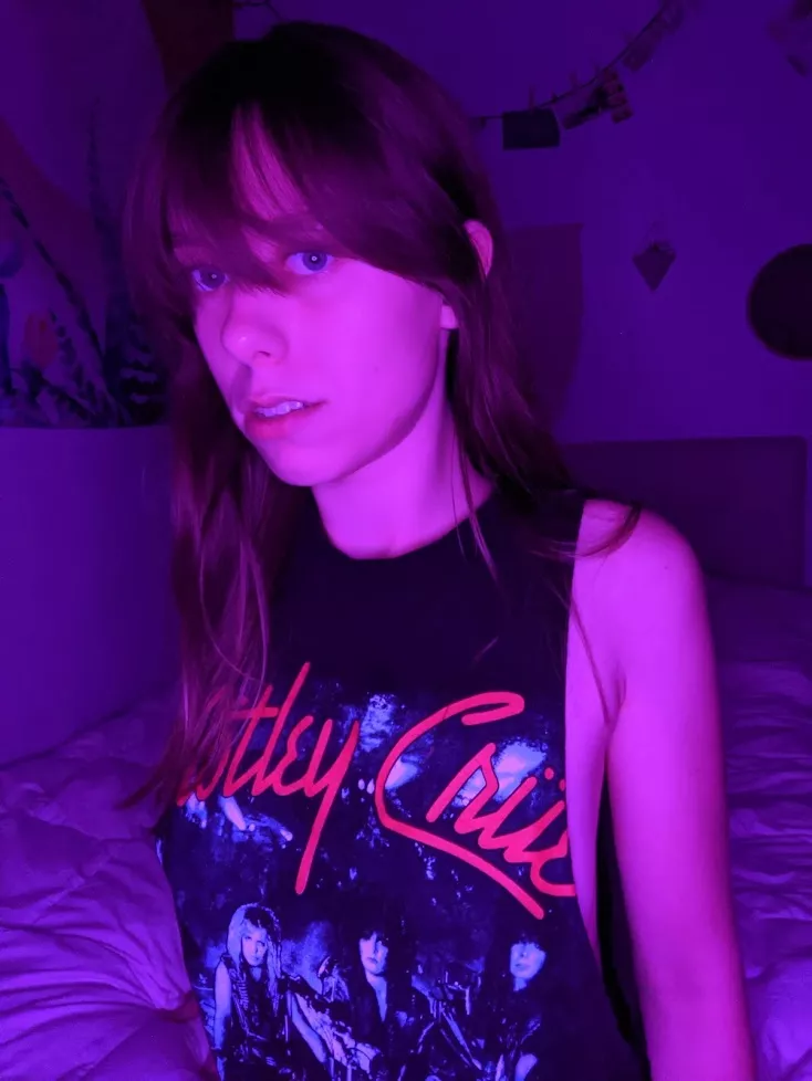 Wearing a Motley Crue tank top. and no bra :) posted by thottypraxis