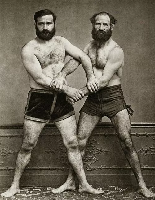 Wrestler bros from circa 1910s. Look at those legs!! posted by naughtyANDnice40s