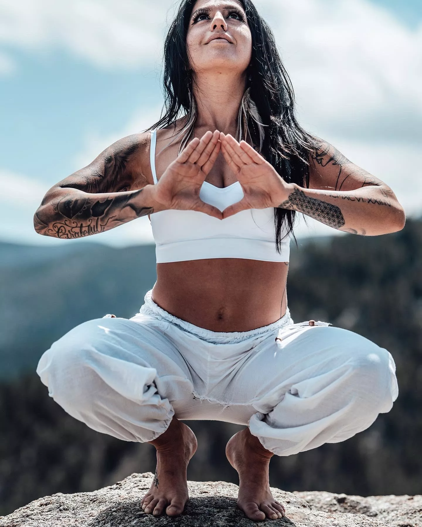 Yoga toes balancing on top of the mountain posted by YogaPhotographer